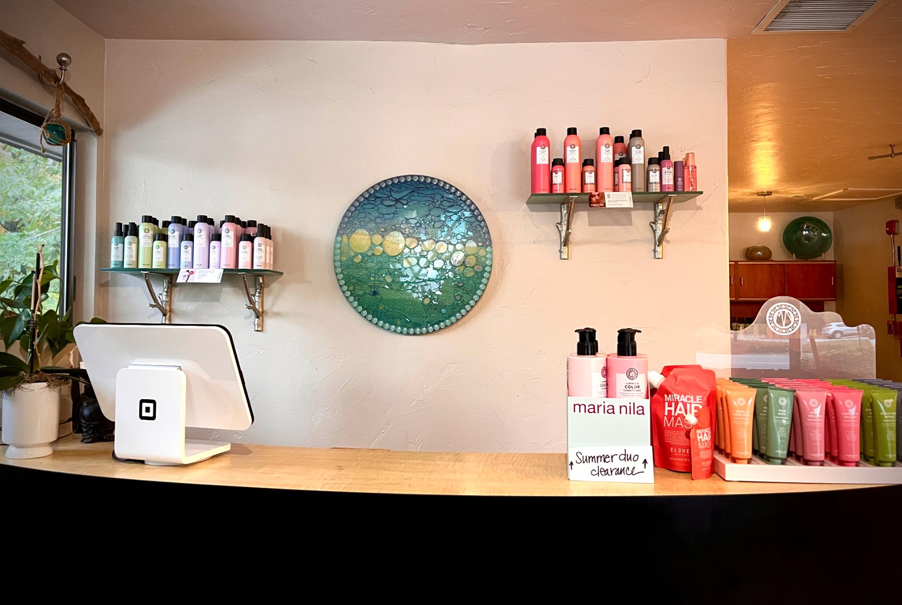 Front desk with Maria Nila products